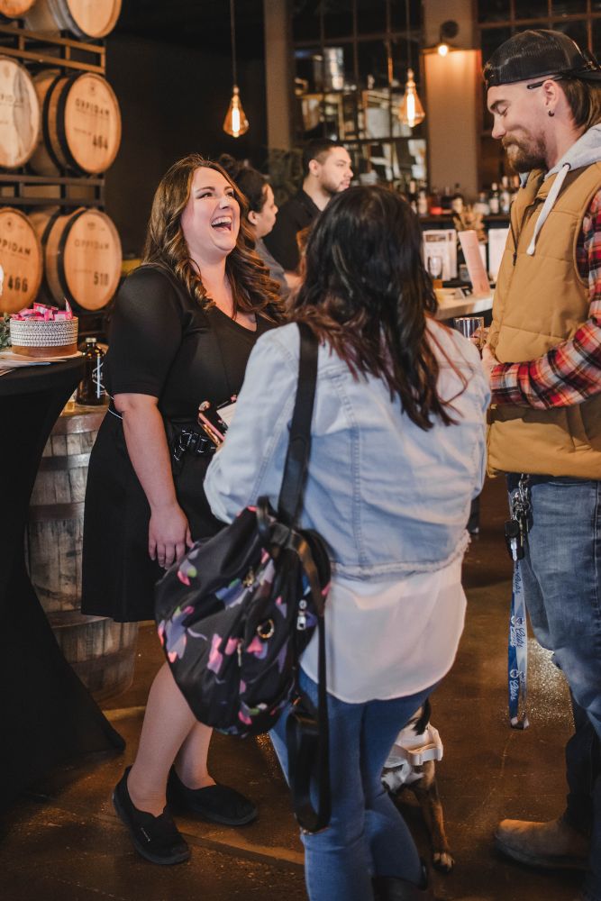 Couples chatting with a wedding vendor at Brews & I Do's Chicagoland Wedding Planning Event